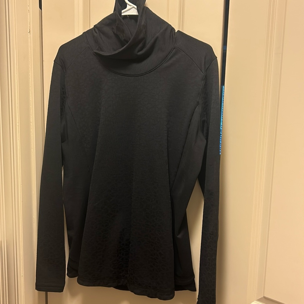 Long sleeve warm weather athletic top.